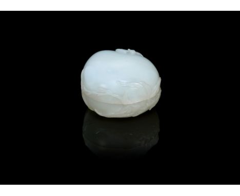A white jade peach-form box and cover18th centuryCarved in relief to the exterior with a bat in flight above flowering, leafy
