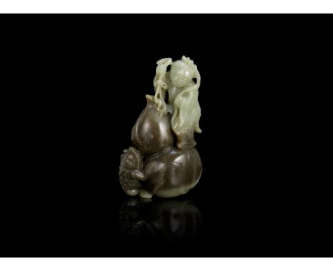 A pale green and mushroom coloured jade 'Liu Hai' groupQing DynastyFinely carved with Liu Hai standing upon a large double go