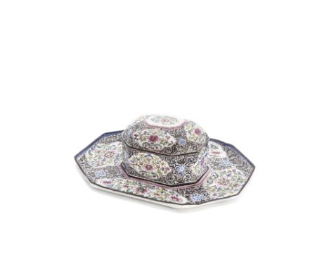 A painted enamel oblong octagonal box, cover and stand18th centuryDecorated with shaped panels of leafy lotus and peony stems