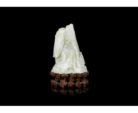 A white jade boulder carving18th/19th centuryDepicting Shoulao on a mountain path before overhanging pine, the reverse with a