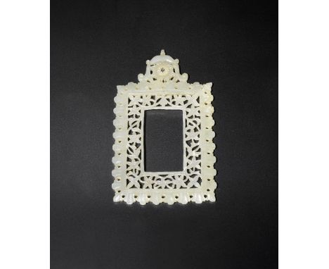 A Mughal jade rectangular frame18th centuryFinely carved in openwork with a scrolling floral meander within a foliate lappet 