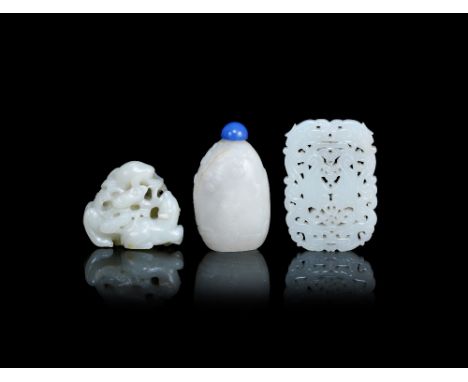 Three jade carvings19th/20th centuryComprising: a reticulated white jade pendant plaque with twin carp within a confronting d