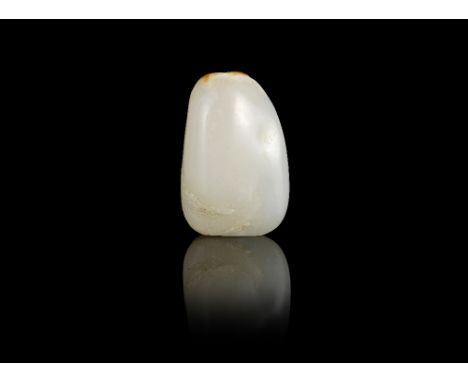 A white and russet jade pebble-form snuff bottle18th/19th centuryOf compressed form, carved around the lower body with blosso
