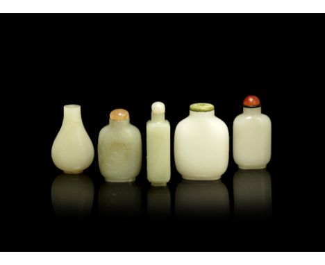 A group of five pale jade snuff bottles&nbsp;Qing Dynasty&nbsp;&nbsp;Comprising: a pale green and russet jade bottle carved w