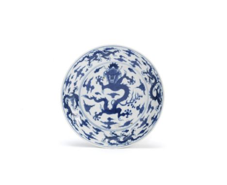 A blue and white 'dragon' dishChenghua six-character mark, KangxiDecorated to the centre with a large forward-facing dragon a