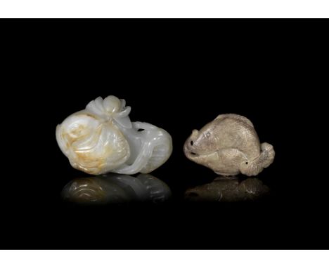 Two jade carvings of fishMing and Qing Dynasties Comprising: a mottled olive green and brown jade 'twin fish' carving; and a 