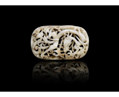A mottled black and white jade reticulated 'dragon' plaqueMing Dynasty Of oval form, carved with a sinuous twin-horned dragon