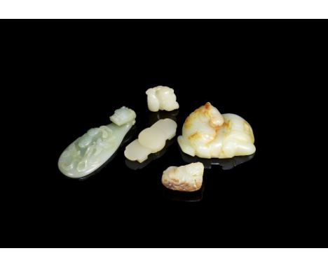 A group of three jade belt plaques and two figural boy carvingsMing Dynasty and laterComprising: a pale green and russet jade