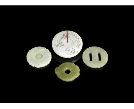 A group of three jade pendants and a jade box and coverQing Dynasty and laterComprising: a white jade reticulated circular pe