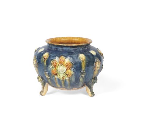 A blue and sancai-glazed pottery tripod incense burnerTang DynastyRaised on three lion mask and paw feet, the body applied wi