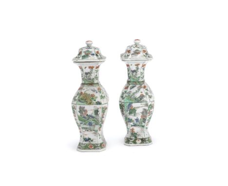A pair of famille verte square-section baluster vases and coversKangxiDecorated with panels of flowering lotus, peonies, figu