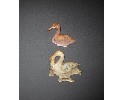 A jade 'cormorant' plaque and a jade 'goose' pendantWestern Zhou DynastyThe cormorant carved from creamy jade, with finely in