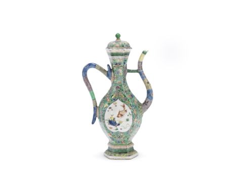 A famille verte ewer and coverKangxiOf hexagonal baluster form, with simulated strap handle, decorated with relief peach-form
