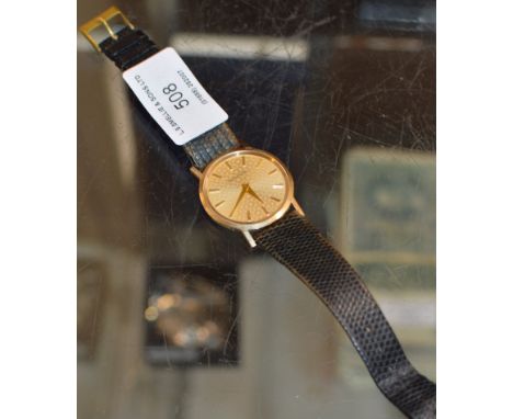 VINTAGE BUECHE-GIROD GENTS 9 CARAT GOLD CASED WRIST WATCH ON LEATHER STRAP     