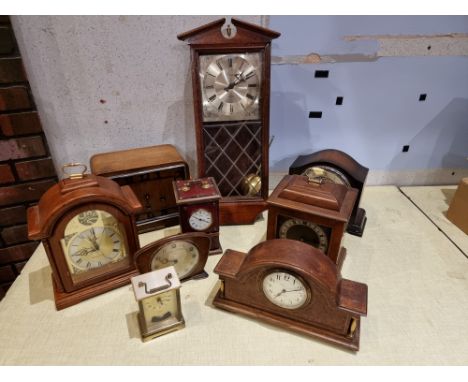 A collection of mantle clocks to include an Edwardian burr walnut and oak clock with a French movement and a Smiths bracket c