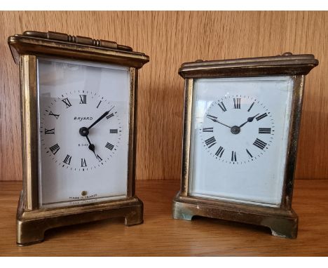 A brass carriage time piece, with white enamel dial, signed Bayard, 8 day, Made in France, the movement signed Duverdrey &amp