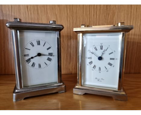 A brass carriage time piece, with white enamel dial, signed Bernard Freres, the movement signed Made in England, 11 cm and an