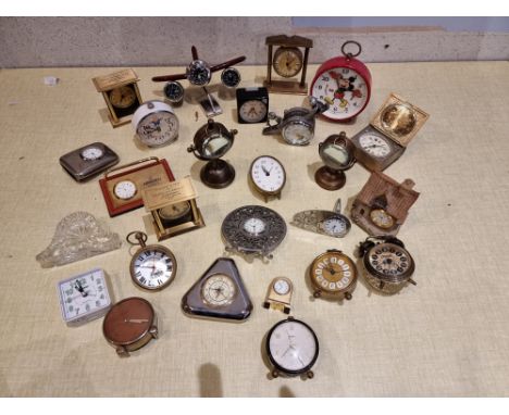 A collection of novelty clocks including a Bradley Walt Disney Mickey Mouse manual wind alarm clock. 