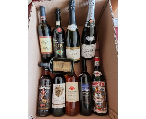 A collection of wines and spirits to include- Laurent Perrier commemorative 1977 champagne, Captain Morgans Original Rum 70cl