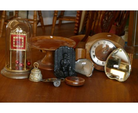 A manual wind anniversary clock under glass dome, together with a Westminster chime mantel clock, an 8 day mantle clock, bras