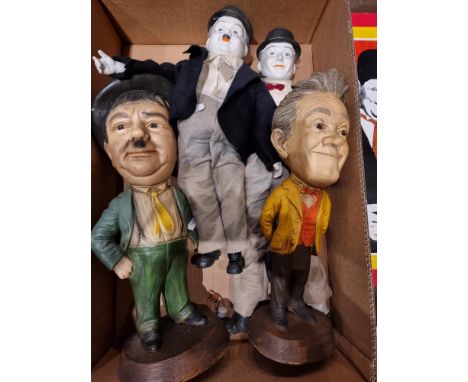 Laurel and Hardy Chalkware Statues ESCO 44 cm tall, together with Laurel and Hardy ceramic dolls, tin plate sign and framed p