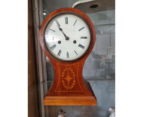 An Edwardian mahogany and boxwood inlaid balloon mantle clock, with German movement, case lacking feet and one hand, 38 cm 