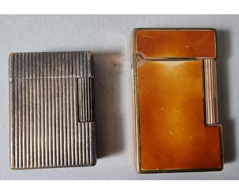 Two Dupont lighters, one ribbed and the other enamel (2). 