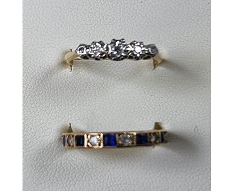 An 18ct gold 5 stone diamond ring, size N 1/2, 1.7 gm and a 9ct gold eternity ring, size K, 2.3 gm (2). 