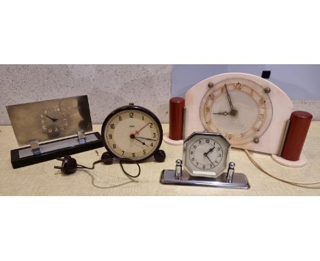 An Art Deco 1920s chrome plated mantle clock together with mid 20th Century mantle clocks. 