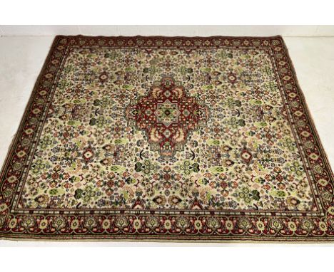 A vintage red ground rug, 266cm x 226cm