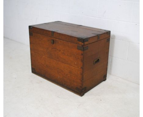 A brass-bound oak trunk, with campaign handles, marked 'Chubb, London' - length 81.5cm, depth 49cm, height 60.5cm