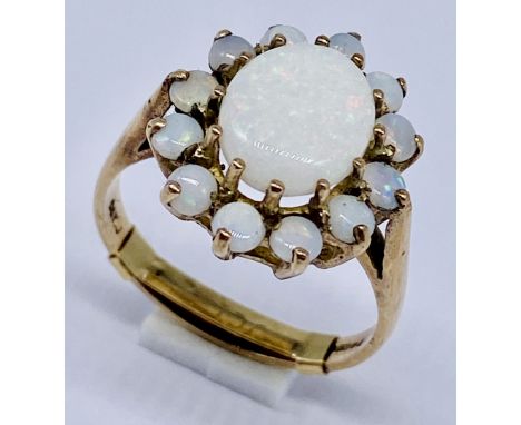 An opal cluster ring set in 9ct gold, size N 1/2