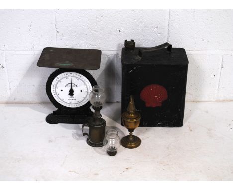 A vintage 'Salters' postal parcel balance scales, along with a vintage Shell petrol can, a brass 'Lampe Pigeon' oil lamp and 