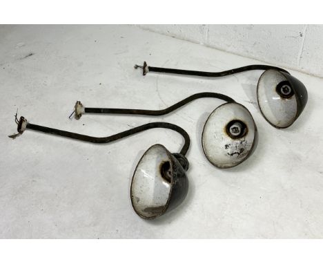 Three vintage exterior light fittings with enamel shades and shaped arm