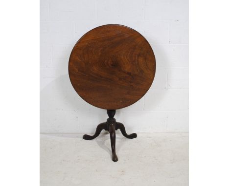 A Georgian mahogany circular tilt-top tripod table, with hoof feet - diameter 74cm, height 71cm