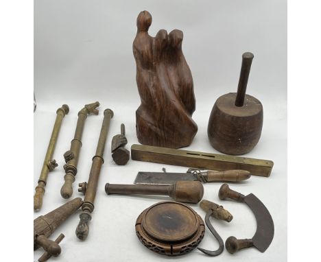 An assortment of miscellaneous items including three vintage wooden and brass garden sprayers, cleaver, wooden sculpture etc 