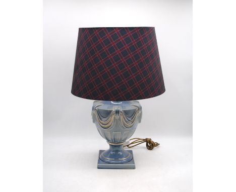 A blue ground ceramic urn shaped table lamp, with shade