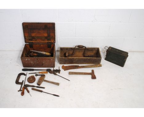 Two vintage wooden crates containing various tools, along with an ammo crate