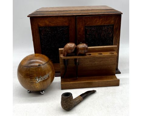 A vintage smokers cabinet along with a selection of pipes, tobacco jar etc