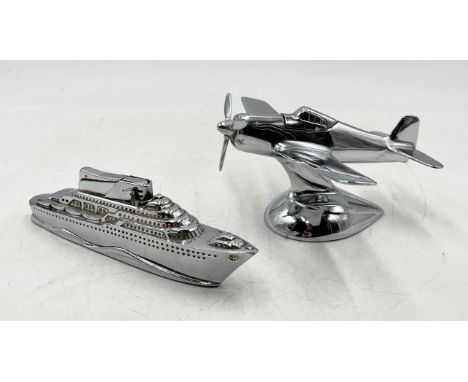 An Art Deco chrome plated table lighter in the form of a Mustang plane along with another in the form of a cruise ship