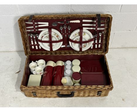 A large "The Brexton Collection"  double picnic hamper including flasks cups, plates, bowls, cutlery, cups etc