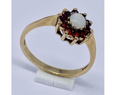 A 9ct gold opal and garnet cluster ring, size N