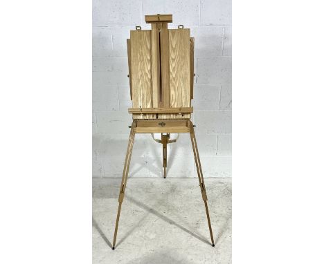 A folding wooden tripod box easel along with a selection of acrylics 