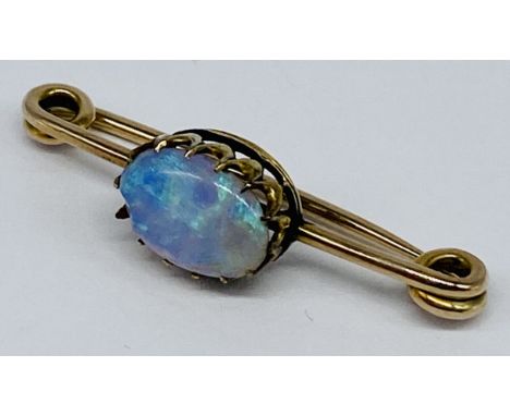 An unmarked gold brooch (tests as 9ct) set with an opal