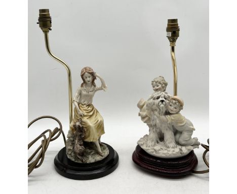 A Capodimonte lamp signed B. Merli  1983 in the form of a dog and two children along with a similar style lamp marked La-Nuov