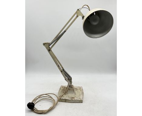 An early Herbert Terry Anglepoise lamp on cast metal base and four springs
