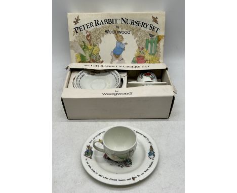 A vintage boxed Peter Rabbit nursery set by Wedgwood, lot also includes an additional cup (repaired) and saucer.  