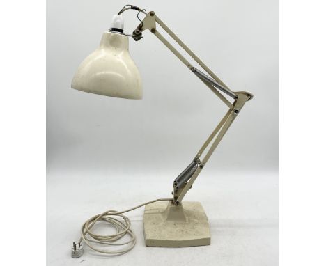 An early Herbert Terry Anglepoise lamp on cast metal base and four springs