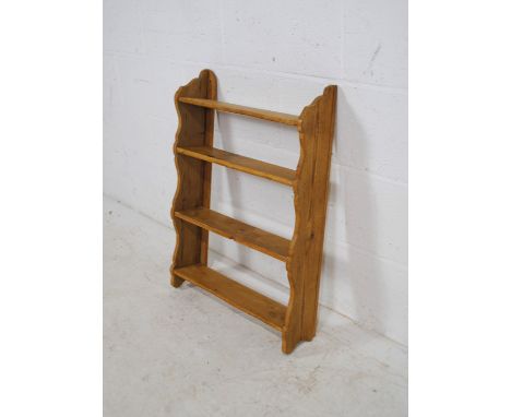 A pine four tier wall hanging shelf - length 51.5cm, height 71cm