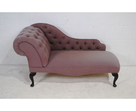 A modern chaise longue of small proportions, with button-back detailing, raised on cabriole legs - length 141cm